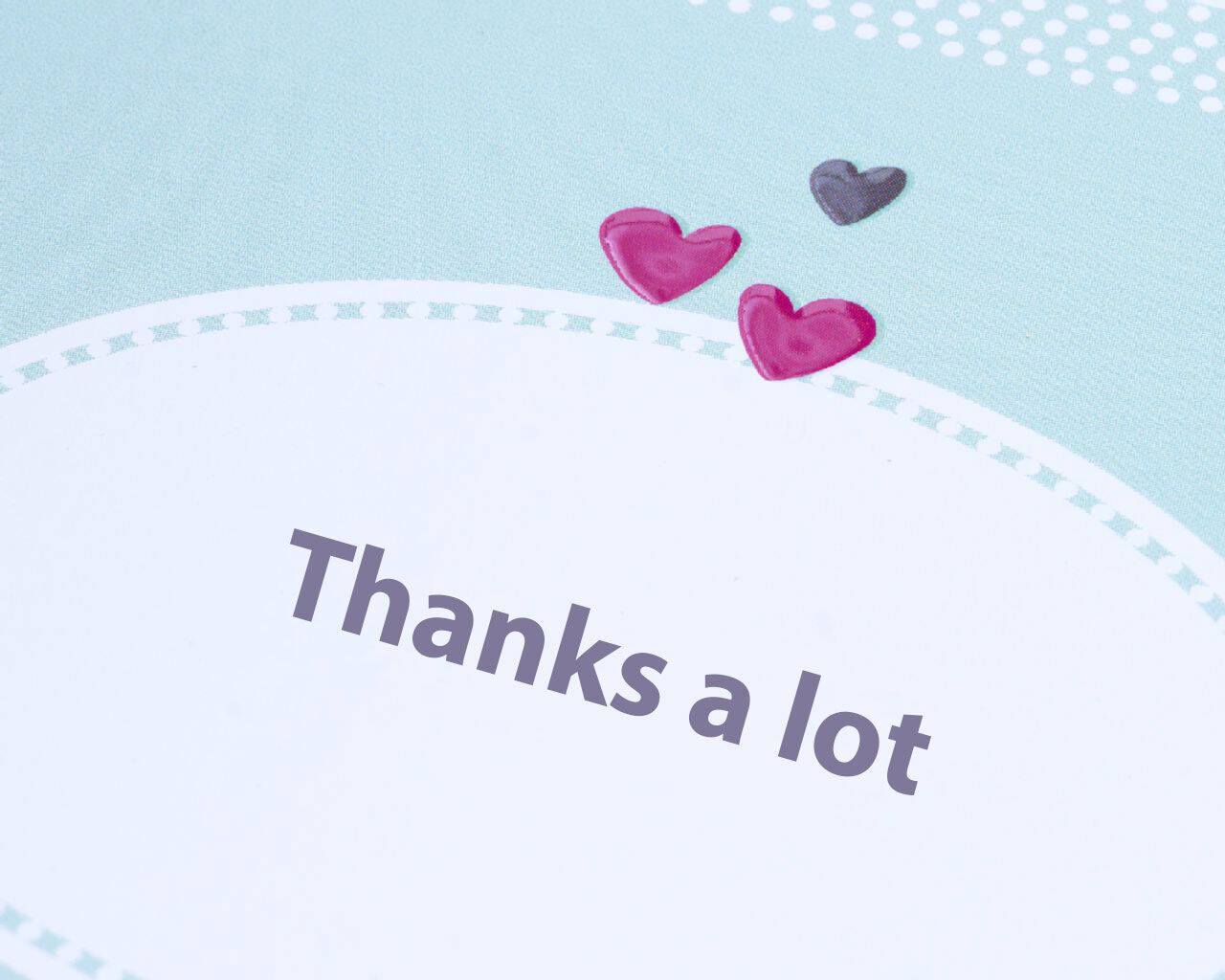 Bedankaart met kleurrijke harten en de tekst 'Thanks a lot'